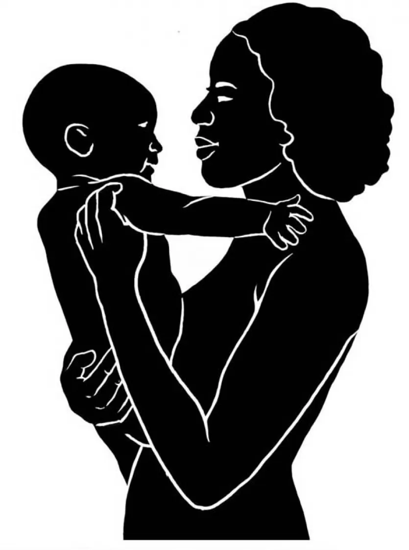 silhouette of mother holding a baby